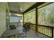 View of a spacious wooden deck with outdoor seating and a ceiling fan, perfect for enjoying the surrounding greenery at 1306 Kings Bottom Dr, Fort Mill, SC 29715