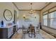Elegant dining room boasting a sophisticated chandelier, stylish accents, and ample natural light at 1306 Kings Bottom Dr, Fort Mill, SC 29715