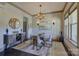 Bright dining room featuring a modern chandelier, stylish decor, and comfortable seating at 1306 Kings Bottom Dr, Fort Mill, SC 29715