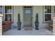 Welcoming front entrance adorned with decorative plants and stylish decor, offering curb appeal at 1306 Kings Bottom Dr, Fort Mill, SC 29715