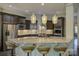 Modern kitchen featuring stainless steel appliances, granite countertops, and a large center island with bar seating at 1306 Kings Bottom Dr, Fort Mill, SC 29715