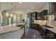 Open concept kitchen with an island, stainless steel appliances, and lots of light from the windows at 1306 Kings Bottom Dr, Fort Mill, SC 29715
