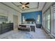 Beautiful primary bedroom showcasing a decorative accent wall, tray ceiling and large windows at 1306 Kings Bottom Dr, Fort Mill, SC 29715