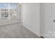 Cozy bedroom with large window and neutral carpet at 133 Capital Ave # B, Mooresville, NC 28117