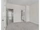 Bright bedroom with ensuite bathroom and neutral carpet at 133 Capital Ave # B, Mooresville, NC 28117
