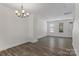 Bright dining room featuring sleek flooring and modern chandelier at 133 Capital Ave # B, Mooresville, NC 28117