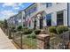 Attractive townhomes feature tidy landscaping, wrought iron fences, and inviting entryways at 133 Capital Ave # B, Mooresville, NC 28117