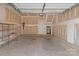 Unfinished garage with bare drywall, concrete floor and simple wooden storage shelves at 133 Capital Ave # B, Mooresville, NC 28117