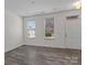 Bright living room with stylish wood floors and plenty of natural light at 133 Capital Ave # B, Mooresville, NC 28117