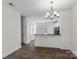 Open floor plan living room with dining area, kitchen, and sleek flooring at 133 Capital Ave # B, Mooresville, NC 28117