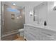 Contemporary bathroom with glass shower, tile, and a bright, airy feel at 1446 Townes Rd, Charlotte, NC 28209