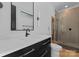 Modern bathroom with sleek vanity, updated fixtures, and glass-enclosed shower at 1446 Townes Rd, Charlotte, NC 28209
