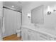 Well-lit bathroom with a vanity, mirror, and shower with curtain at 1446 Townes Rd, Charlotte, NC 28209