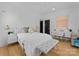 Bright bedroom with a comfortable bed, desk, and ample natural light at 1446 Townes Rd, Charlotte, NC 28209