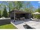 View of the cabana with lounge chairs and outdoor seating by the pool at 1446 Townes Rd, Charlotte, NC 28209