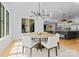 Dining room features a modern chandelier and large windows with lots of natural light at 1446 Townes Rd, Charlotte, NC 28209