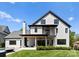 Rear exterior view of a two-story home with a patio, balcony, and well-manicured yard at 1446 Townes Rd, Charlotte, NC 28209