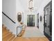 Bright and airy foyer featuring hardwood floors, modern light fixtures, and stylish accents at 1446 Townes Rd, Charlotte, NC 28209