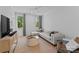 Cozy living room featuring a plush sectional sofa and neutral decor at 1446 Townes Rd, Charlotte, NC 28209