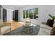 Elegant living room featuring hardwood floors, natural light, and sophisticated furnishings at 1446 Townes Rd, Charlotte, NC 28209