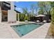 Backyard pool and patio area with lounge chairs and a covered outdoor living area at 1446 Townes Rd, Charlotte, NC 28209