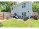 Backyard patio with a grill, string lights, and outdoor seating at 1529 Briar Creek Rd # 1A, Charlotte, NC 28205