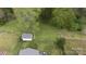 Aerial view of property with a shed surrounded by green grass and trees at 1540 Coatsworth Ln, Rock Hill, SC 29732