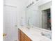 Bright bathroom features double sinks, wood cabinets, a large mirror and ample counter space at 1540 Coatsworth Ln, Rock Hill, SC 29732