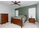 Comfortable bedroom with classic wood furniture, ceiling fan, and ample natural light at 1540 Coatsworth Ln, Rock Hill, SC 29732