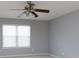 Neutral bedroom featuring a window with blinds and light gray walls at 1540 Coatsworth Ln, Rock Hill, SC 29732