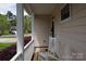 Inviting front porch with rocking chairs, perfect for enjoying the outdoors at 1540 Coatsworth Ln, Rock Hill, SC 29732