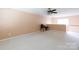 Open living area with neutral walls, plush carpet, and bright natural light from the nearby window at 1540 Coatsworth Ln, Rock Hill, SC 29732