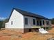 Exterior view of new home with installed siding and black trim at 169 Hickory Grove Rd, Harmony, NC 28634