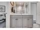 Bright bathroom featuring gray vanity with marble countertop, modern fixtures, and tiled shower reflected in the mirror at 17315 Langston Dr, Charlotte, NC 28278