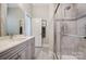 Modern bathroom with a glass shower, marble countertops, and tile floor at 17315 Langston Dr, Charlotte, NC 28278