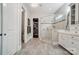 Modern bathroom with a glass shower, tile floor, and a walk-in closet at 17315 Langston Dr, Charlotte, NC 28278
