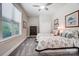 Bedroom with two beds, a window, and a ceiling fan at 17315 Langston Dr, Charlotte, NC 28278