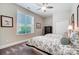 Bedroom with two beds, dresser, window, and a ceiling fan at 17315 Langston Dr, Charlotte, NC 28278