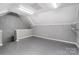 A bonus room space with neutral gray paneling and flooring, great for storage or home office use at 17315 Langston Dr, Charlotte, NC 28278