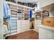Spacious walk-in closet with custom shelves and wooden floors at 17315 Langston Dr, Charlotte, NC 28278