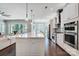 Bright kitchen featuring stainless steel appliances, a large island, and an open floor plan at 17315 Langston Dr, Charlotte, NC 28278