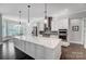 Modern kitchen with stainless steel appliances, a large island, and a breakfast nook at 17315 Langston Dr, Charlotte, NC 28278