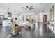Spacious open-concept living room featuring hardwood floors and a ceiling fan at 17315 Langston Dr, Charlotte, NC 28278