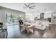 Bright living room with hardwood floors, a ceiling fan, and backyard views at 17315 Langston Dr, Charlotte, NC 28278