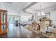 Open-concept living space with hardwood floors, a fireplace, and lots of natural light at 17315 Langston Dr, Charlotte, NC 28278