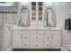 A close up of dual vanities in a bathroom with plenty of storage at 17315 Langston Dr, Charlotte, NC 28278