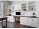 Home office with custom cabinetry and shelving for storage and organization at 17315 Langston Dr, Charlotte, NC 28278