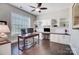 Bright home office with custom built-ins, a desk, and a large window at 17315 Langston Dr, Charlotte, NC 28278