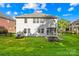 Spacious backyard with well-maintained lawn and back of the house at 17413 Caddy Ct, Charlotte, NC 28278