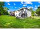 Expansive backyard with manicured lawn and view of the rear of the home at 17413 Caddy Ct, Charlotte, NC 28278